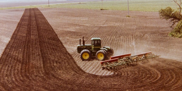 History of Campbell Farms - tilling a field